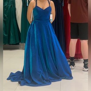 Brand new metallic blue dress. Has never been worn, only when fitting and pics